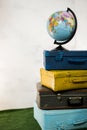 Travel or turism concept. Close up globe on vintage suitcases Royalty Free Stock Photo