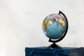 Travel or turism concept. Isolated globe on blue suitcase Royalty Free Stock Photo