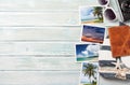 Travel vacation background concept with sunglasses, camera and weekend photos on wooden backdrop. Top view with copy space. Flat Royalty Free Stock Photo