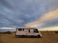 Travel vacation lifestyle with camper parked at the beach with sea view- Recreational vehicle camping car camp in the nature. Royalty Free Stock Photo