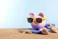 Travel vacation money, retirement plan, Piggy Bank on beach, copy space