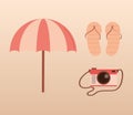 travel vacations beach umbrella flip flops and photography camera