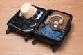 Travel and vacations concept. Open traveler`s bag with clothing,
