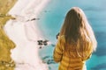 Travel vacations woman tourist standing above ocean