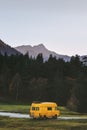 Travel van yellow camper road trip vacations in mountains