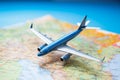 Travel visualization Close up of a map with model airplane background