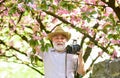 travel and walking in cherry park. hobby at retirement. tourism and holiday. traveler camera man under sakura bloom