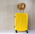 Travel yellow baggate and straw cowgirl hat Royalty Free Stock Photo