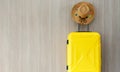 Travel yellow baggate and straw cowgirl hat Royalty Free Stock Photo