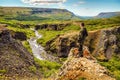 Traveler against picturesque Icelandic landscape.