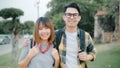 Traveler Asian couple feeling happy smiling to camera holiday trip at Thailand, backpacker sweet couple enjoy their journey at Royalty Free Stock Photo