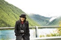 Traveler asian thai woman travel and posing for take photo at Apls mountain and Fedaia Lake Royalty Free Stock Photo