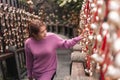 Traveler asian woman look  the gold bells of wish wall on Wenwu Temple, Taiwan Royalty Free Stock Photo