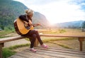 Traveler asian women playing acoustic guitar Royalty Free Stock Photo