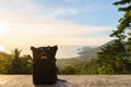 Traveler backpack against beautiful scenic landscape during the sunset