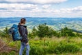 Traveler with a backpack. Mountain landscape with beautiful clouds. Ukraine. Carpathians. Travels. Hiking.