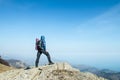 Traveler with backpack on the top of the mountain Royalty Free Stock Photo