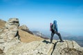 Traveler with backpack on the top of the mountain Royalty Free Stock Photo