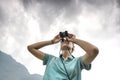 Traveler with binoculars in Sapa Valley Royalty Free Stock Photo