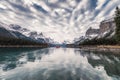 Traveler canoeing on Maligne lake with altocumulus clouds in Jasper Royalty Free Stock Photo