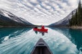 Traveler canoeing on Maligne lake with canadian rockies reflection in Spirit Island at Jasper national park Royalty Free Stock Photo