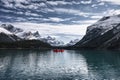 Traveler canoeing on Maligne lake with Canadian rockies in Spirit Island at Jasper national park Royalty Free Stock Photo