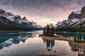 Traveler canoeing with rocky mountain reflection on Maligne lake at Spirit island in Jasper national park Royalty Free Stock Photo