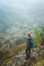 Traveler on cobbled path admiring spectacular lush green valley. Santo Antao island in Cabo Verde Royalty Free Stock Photo