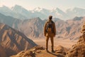 the traveler conquers the peaks of the mountains generative ai Royalty Free Stock Photo