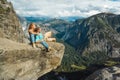 Traveler couple man and woman in Yosemite National Park, scenic view at Valley and Mountains from Upper Yosemite Falls, USA