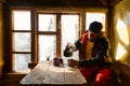 Traveler is drinking coffee and dreaming in a old mountain hut Royalty Free Stock Photo