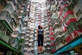 Traveler Exploring Densely Populated Housing Apartments in Hong Kong Royalty Free Stock Photo