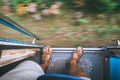 Traveler feet on the train tambour during the train move