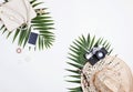 Traveler feminine accessories and tropical palm leaves Royalty Free Stock Photo