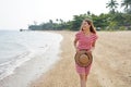 Traveler girl on empty tropical beach. Young woman walking relaxed on sand beach in Brazil. Escape travel concept Royalty Free Stock Photo