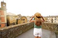 Traveler girl enjoying townscape of Orvieto from a terrace of historic palace, Orvieto, Umbria, Italy Royalty Free Stock Photo
