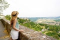 Traveler girl enjoying view of Umbria hills from Orvieto town, Italy