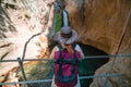 Traveler girl with leather hat and backpack posing at the sapadere canyon and waterfall, Nature, Travel and vacation concept.