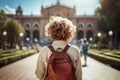 Traveler girl in street of old town in Spain. Young backpacker female tourist in solo travel. Vacation, holiday, trip