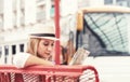 Traveler girl is waiting for a bus at the bus station. Trip to E Royalty Free Stock Photo