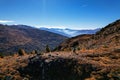 A traveler guy films a panoramic landscape with a drone on the trail in Austrian Alps Royalty Free Stock Photo