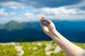 Traveler hand holds a compass on the beautiful Carpathian mountains during vacation. Horizontal banner with place for Royalty Free Stock Photo