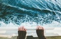 Traveler holding hands above sea view on ferry ship