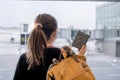 Traveler holding passport and boarding passes waiting to transfer from one terminal to another Connecting flight at the Royalty Free Stock Photo