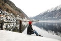 Traveler-Image. Traveler look at the mountain lake in winter. Travel and active life concept. Adventure and travel in Royalty Free Stock Photo