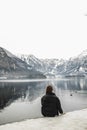 Traveler-Image. Traveler look at the mountain lake in winter. Travel and active life concept. Adventure and travel in the Royalty Free Stock Photo