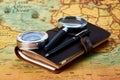 Traveler items on map background with copy space, close-up Royalty Free Stock Photo