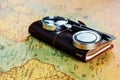 Traveler items on map background with copy space, close-up Royalty Free Stock Photo