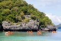 Traveler kayaking in the thai ocean from backward view