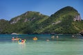 Traveler kayaking in the thai ocean from backward view